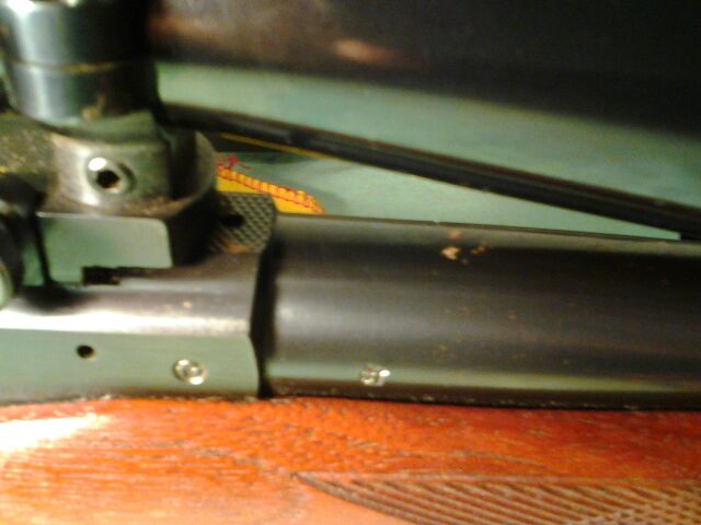 Tikka M55 small rust on barrel and mount area.jpg